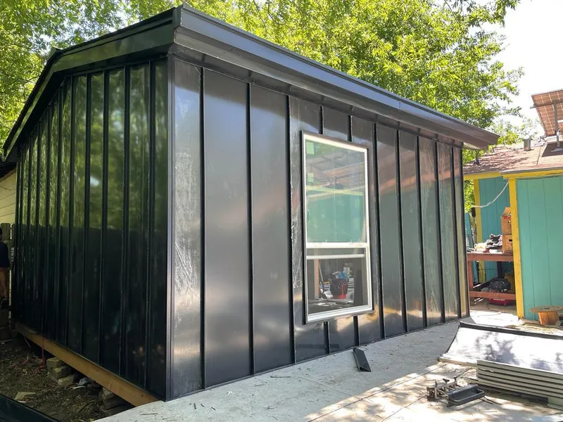 Black standing seam metal wall panels for Roof Inspection in Long Grove