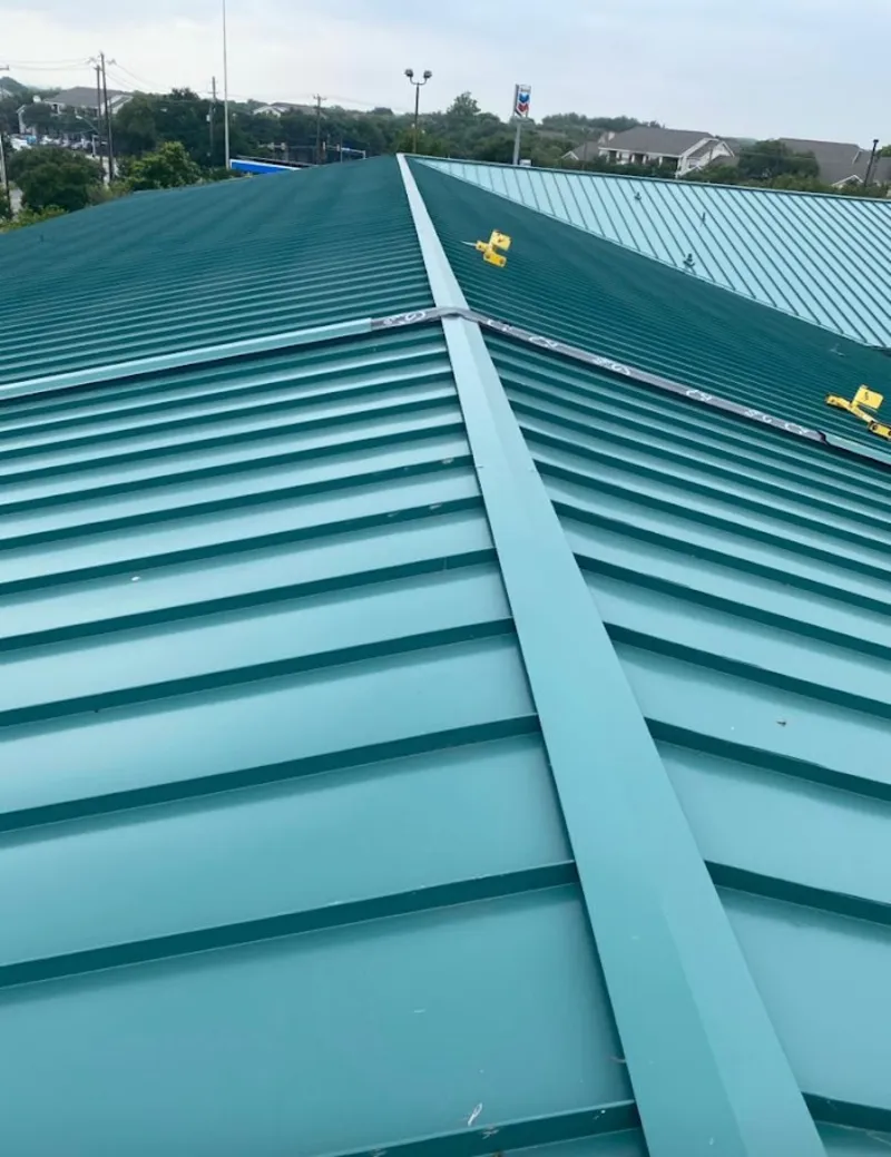 Green commercial metal roof ridge and valley for Metal Roof Repair in Long Grove